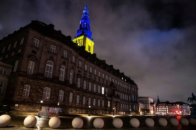 Christiansborg Palace in Copenhagen illuminated with the colors of the Ukrainian flag in a show of support.