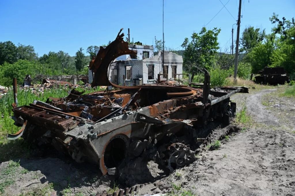 This photograph taken on June 22, 2023, shows remains of destroyed Russian tanks next to a destroyed house in the town of Svyatogirsk, Donetsk region, amid the Russian invasion of Ukraine. 