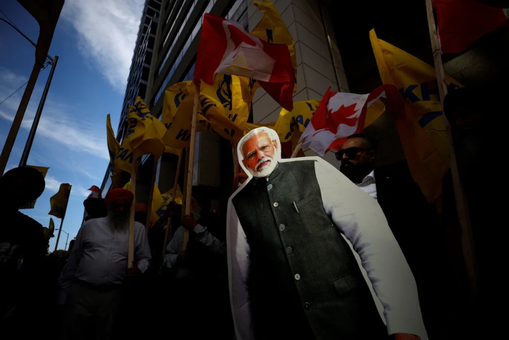 Protesters, angered by the death of Sikh activist Hardeep Singh Nijjar in Surrey, B.C., display a cardboard cutout of Modi during a rally outside the Indian Consulate in Toronto last September. (Cole Burston/AFP/Getty Images)